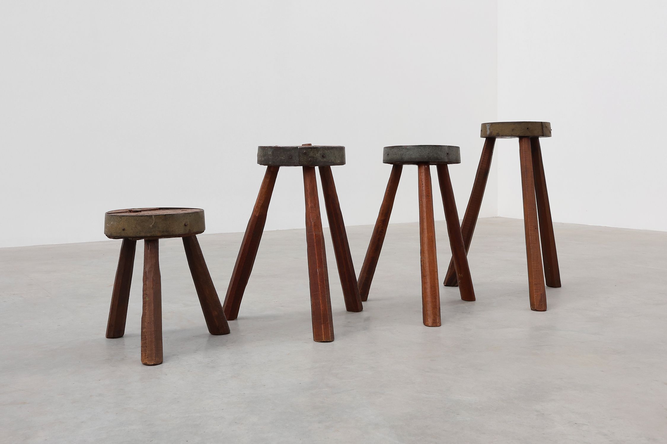 Brutalist French 1850s solid oak tripod stools with metal rim, set of 4thumbnail